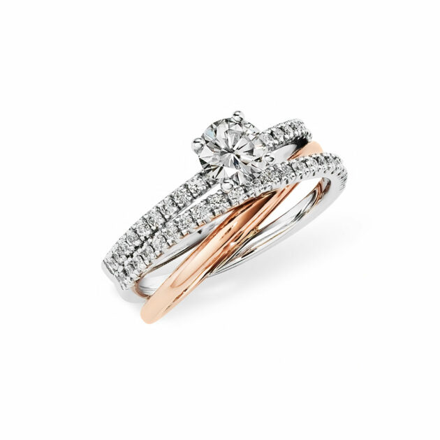 Where modern design meets timeless sparkle, the Donatella Bellissima Engagement Ring is simply stunning. One 9ct Rose Gold Bands and two 9ct White Gold Bands in a Crossover Design. Set with one 0,60ct Round Moissanite centre stone. Complemented by 39 Pave Set Round Accent Stones. Custom Metamophosis Jewellery from Jose Jewellers, Benoni, South Africa.