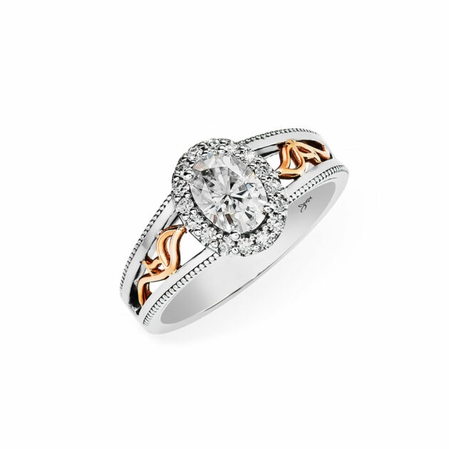 Elegant Elena 9ct White Gold Engagement Ring. With Old-world Charm the Oval Moissanite Centre Stone is surrounded by 14 x Round Moissanite Halo Setting. Bellissima Engagement Rings from Metamorphosis Collection. Benoni South Africa.